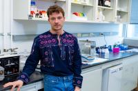 Mijo Simunovic standing in laboratory